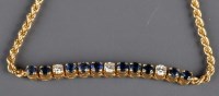 Lot 871 - A sapphire and diamond bracelet, the upper...