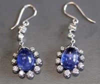 Lot 885 - A pair of sapphire and diamond earrings of...