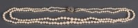 Lot 889 - A cultured pearl, diamond and cats-eye...