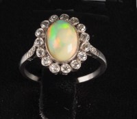 Lot 904 - An Edwardian opal and diamond ring, the oval...