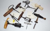 Lot 990 - A collection of corkscrews, to include: a...