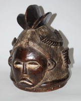 Lot 1058 - A Mende helmet mask, Sierra Leone, with...