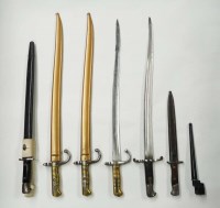 Lot 1073 - A collection of seven bayonets, to include: a...