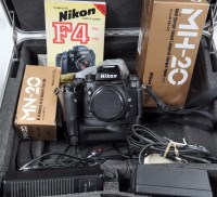 Lot 1106 - A Nikon F4 SLR camera with NB23 motor drive,...