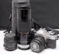 Lot 1108 - A Canon AE-1 SLR camera, fitted FD 50mm f1.8...