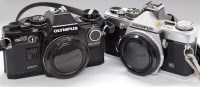 Lot 1112 - An Olympus OM-2n camera body (chrome); and an...