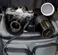 Lot 1167 - A Cannon AE-1 SLR camera, fitted a FD 28-55mm...