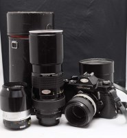 Lot 1177 - A Nikkormat SLR camera (black), fitted...