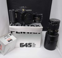 Lot 1190 - A Pentax 645 medium-format SLR camera; a 75mm...