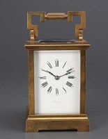 Lot 1281 - A brass carriage clock, with enamelled roman...