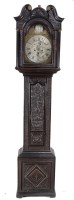 Lot 1295 - A longcase clock in ornately carved dark...