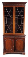 Lot 1324 - A Georgian style mahogany bookcase with a...