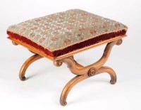 Lot 1356 - A late Regency walnut stool with original...