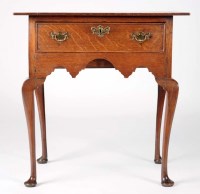 Lot 1374 - A George III rectangular oak lowboy, fitted a...