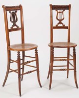 Lot 1379 - A pair of late 19th Century harpist stools...