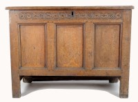 Lot 1388 - An 18th Century oak coffer, the front with...