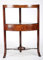 Lot 1433 - A late George III mahogany corner wash stand,...