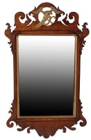 Lot 1447 - A George III mahogany parcel gilt wall mirror,...