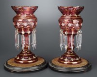 Lot 199 - A pair of ruby glass lustres, with gilded and...