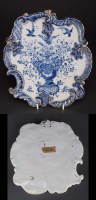 Lot 230 - A Dutch Delft plaque, of rococo form and...