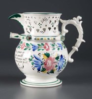 Lot 233 - A Pearlware puzzle jug, of typical form with...