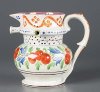 Lot 270 - A Pearlware puzzle jug, early 19th Century,...