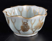 Lot 300 - A Celadon glazed and gilded wine cup, of lotus...
