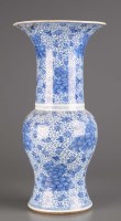 Lot 310 - A blue and white vase, the flared top above a...