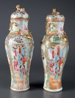 Lot 314 - A pair of Canton enamel vases and covers,...