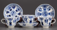 Lot 318 - Three blue and white tea cups and saucers,...