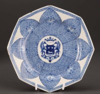 Lot 319 - A blue and white armorial wall plate, with...