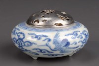 Lot 323 - A blue and white tripod censer, painted with...