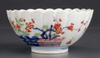 Lot 325 - An Imari bowl; of fluted form, painted with...