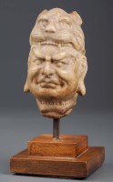 Lot 351 - A carved stone head of a Bodhisattva, possibly...