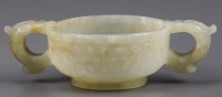 Lot 356 - A celadon jade cup, the stone of mottled tone,...