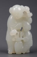 Lot 359 - A white jade figure group, 18th Century, the...