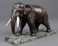 Lot 367 - A bronze model of an elephant, with ivory...