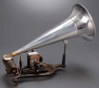 Lot 435 - A 'Puck' phonograph, on black and gold painted...