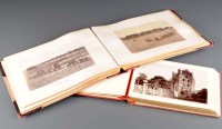 Lot 548 - Two albums of postcards and photographs of...