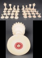 Lot 551 - An ivory chess set, one set stained with red...