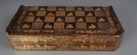 Lot 562 - A 19th Century Chinese lacquered games board,...