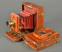 Lot 573 - A J. Lancaster folding plate camera, 'The...