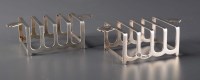 Lot 613 - A pair of George VI five bar toast racks, by...