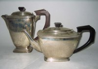 Lot 622 - A George VI teapot and matching hot water jug,...