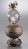 Lot 724 - A white metal and rock crystal ornament,...