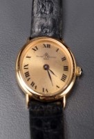 Lot 750 - Baume & Mercier: a lady's 18k wristwatch, the...