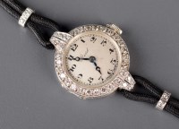 Lot 765 - A lady's diamond encrusted cocktail watch, the...