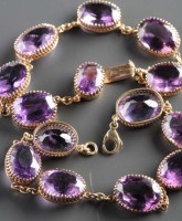 Lot 792 - Two amethyst bracelets, each set with seven...