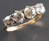 Lot 793 - A four stone diamond ring, the four slightly...