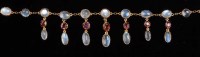 Lot 795 - A moonstone and garnet necklace, c.1890, the...